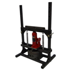 The KKP Bead Breaker is a black hydraulic bench press featuring a red bottle jack mounted at its center. It boasts adjustable vertical posts and a sturdy base for enhanced stability.