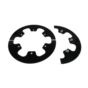 Two black circular 6-Spoke Sprocket Hub Gear Guards made of carbon fiber, one intact and the other broken into two pieces, against a white background.