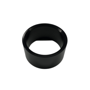 An Axle Spacer - 1-1/4" ID x 1/8", featuring a black cylindrical shape with a hollow center and smooth surface, is shown on a white background.