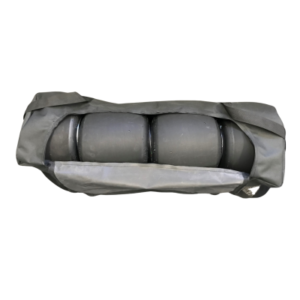 The Tire Bag is a black cylindrical object enclosed partially in a black fabric cover, displaying two distinct sections with a central seam.