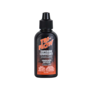 A black 6oz drip bottle of Tri-Flow Lubricant featuring a red label, designed for penetrating and lubricating surfaces.