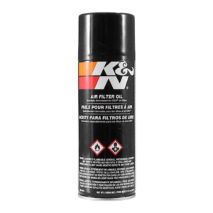 A cylindrical aerosol can of K&N Air Filter Oil - Spray featuring a black cap and label, adorned with hazard symbols and multilingual text instructions.