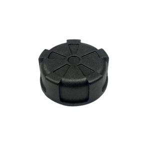 A replacement cap for a plastic fuel tank, black and round with six raised segments on its top surface.