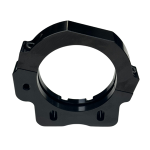 A black, circular mechanical part with a flat base and two side holes for mounting, specifically the Rear Axle Cassette Right Side for Big Bearing - Pursuit & Xpect.