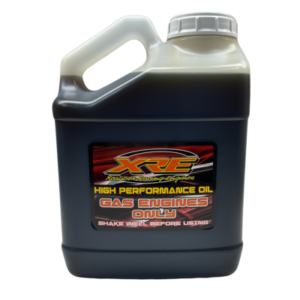 A jug of X-Caliber Oil for gas engines. The label advises to shake well before using.