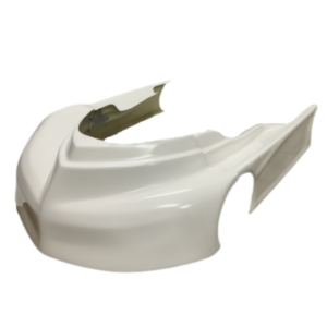 White motorcycle seat cowl with aerodynamic design, viewed from an angle, showing two cutouts and smooth surface.